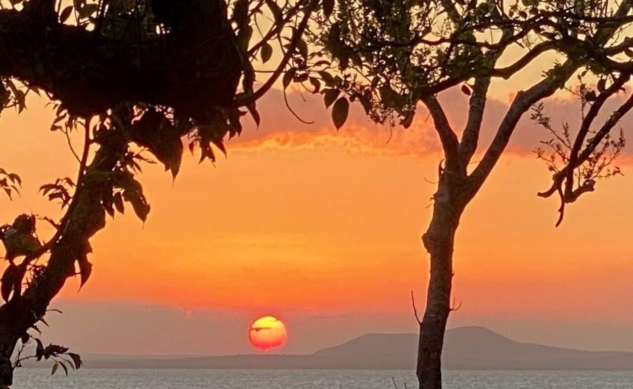 Sun setting over Sunset Beach Bungalows Sunset over Sunset Beach Bungalows, Whitsundays, Queensland