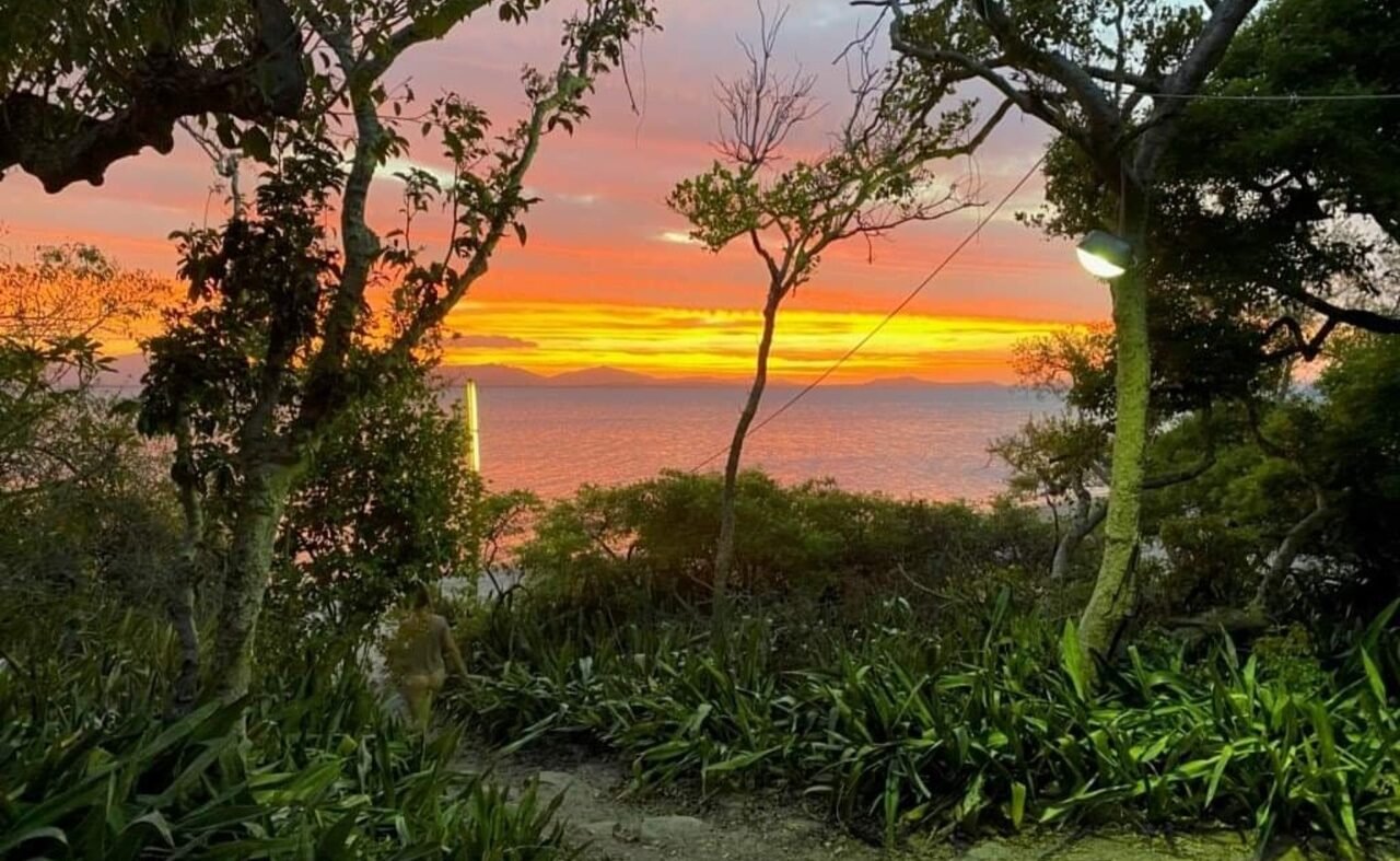 Sunset through the bush Cape Gloucester Sun setting through the view of the bushes